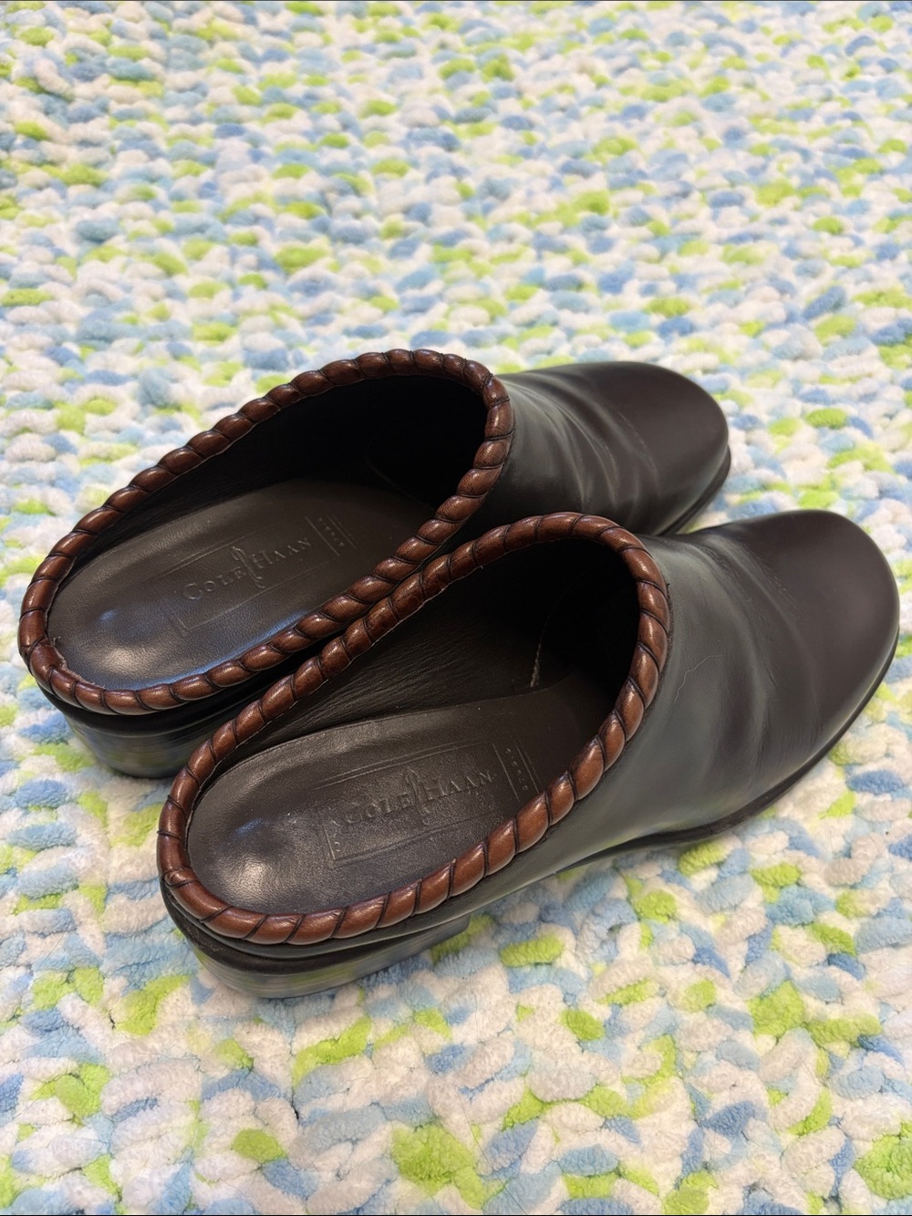 Cole Haan brown leather mules with a woven collar detail